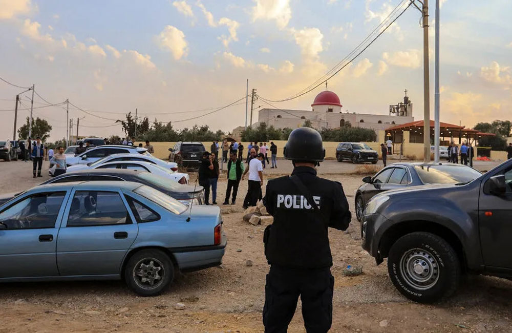 Seven killed and 40 injured after gunmen open fire at church funeral in Jordan
