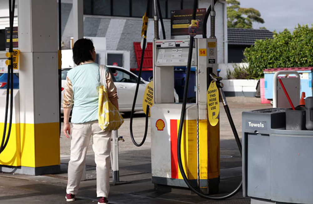 Australia to halve tax on petrol to bring down costs in wake of Iran war