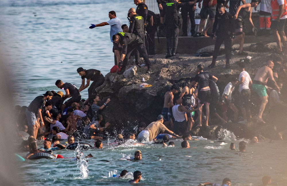 Spain deploys military to Ceuta after thousands of people breach Morocco’s border and at least 9 die